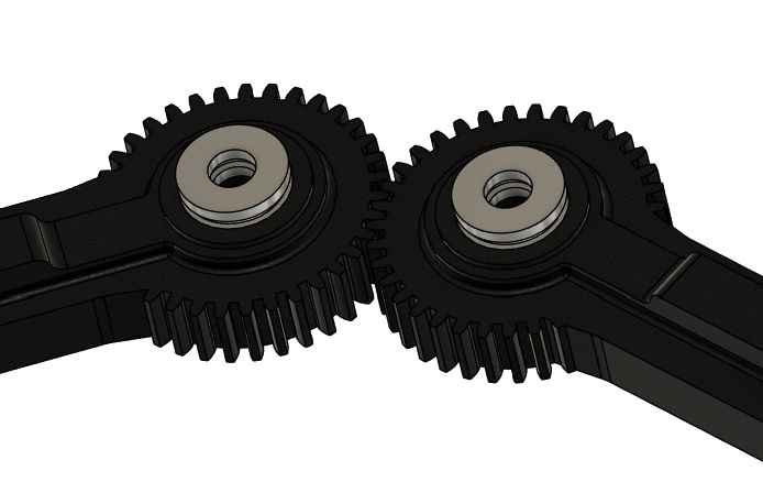 Close-up of the meshed gears at the base of the lower arms