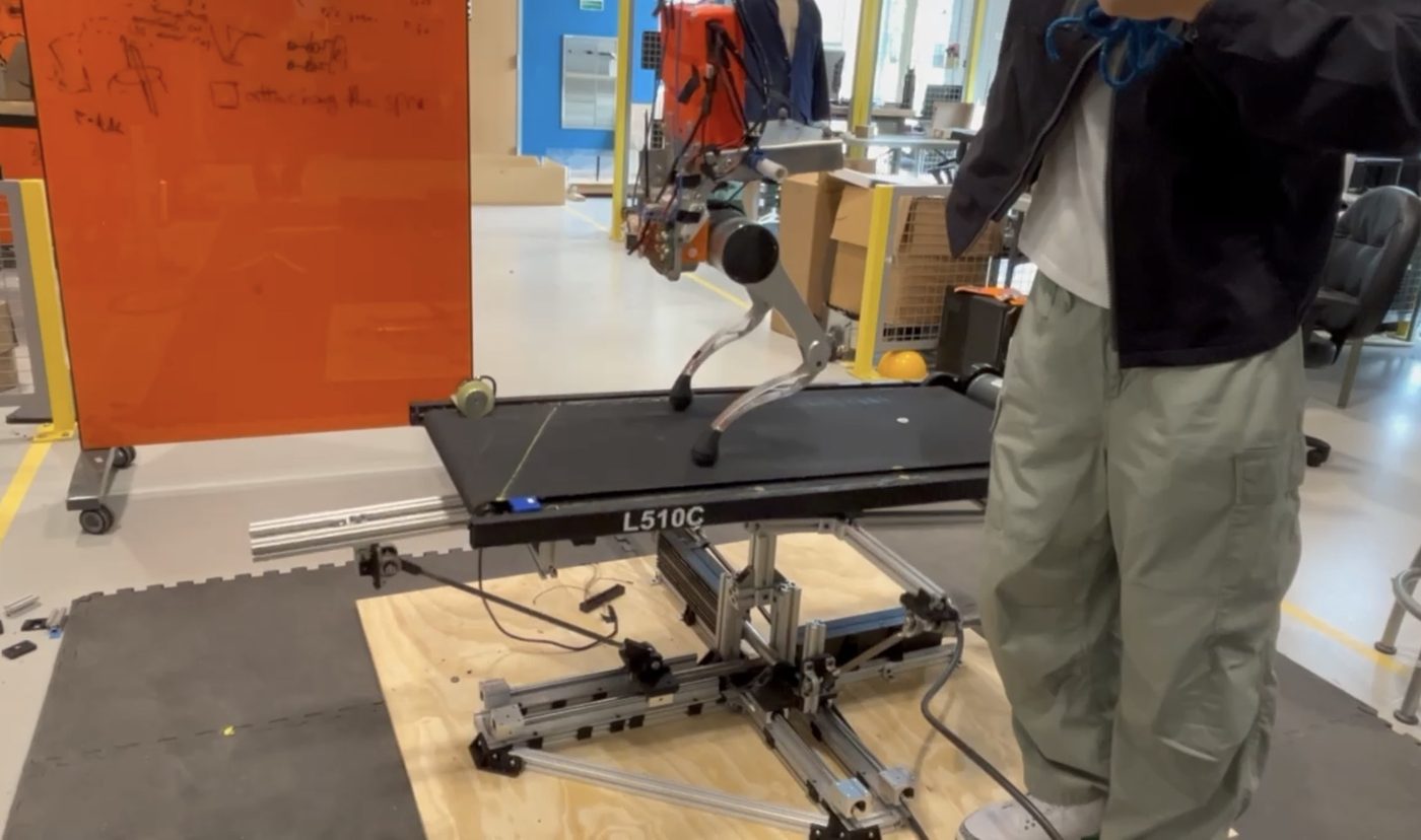The platform with a treadmill and a biped robot on top